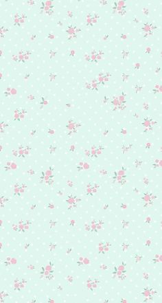 a blue background with pink flowers and polka dots