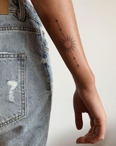 a person with a small tattoo on their arm