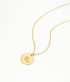 "Make a jewelry statement with this delicate birth sign charm Necklace. This necklace looks great alone or layered! The disc can be engraved on one or both sides. Please leave a note in the message box at checkout with the details of birth sign you prefer, personalization, metal, necklace length and type, etc. Disc charm is 13mm/ 0.4\" EVERYTHING IS CUSTOMIZABLE! - - - - - - - - - - - - - - - METAL OPTIONS ✦ 14K yellow gold filled ✦ 14K rose gold filled ✦ Sterling Silver - - - - - - - - - - - - Gold Engraved Charm Necklace For May Birthstone, Minimalist Zodiac Sign Jewelry Gift, Minimalist Zodiac Sign Round Pendant Jewelry, Minimalist Zodiac Sign Jewelry, Dainty Zodiac Sign Round Pendant Jewelry, Everyday Zodiac Sign Round Jewelry, Star Sign Necklace, Astrology Necklace, Sign Necklace