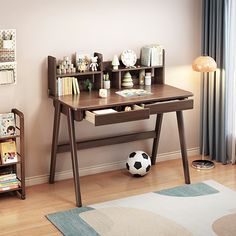 a child's desk with books and toys on it in a room next to a window