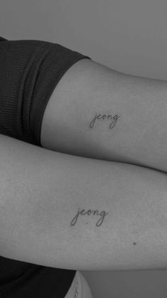 two people with matching tattoos on their arms that say jenny and jeong in cursive writing