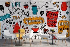 a wall mural with different types of coffee related items on it, including cups and saucers