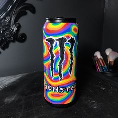 a monster energy drink sitting on top of a table