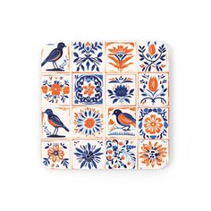 an orange, blue and white plate with birds on the tiles in different patterns is shown