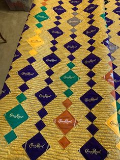 a quilted table top with several different colored squares on it