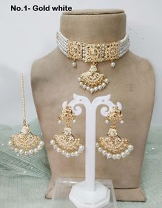 Jadau gold plat pearl beads choker necklace set with gold plating and embellished with pearl. * Light Weight Jadau gold choker necklace. White Bridal Necklace For Eid, Gold Bollywood Style Pearl Chain Jewelry Sets, Bollywood Style Gold Jewelry Sets With Pearl Chain, Bollywood Style Gold Pearl Chain Jewelry Set, Bollywood Style Gold Pearl Jewelry Sets, Bollywood Style White Pearl Necklace For Parties, Traditional Gold Pearl Choker, Gold Pearl Chain Choker For Wedding, Festive Gold Choker With Pearl Chain