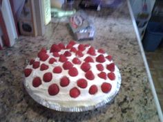 a cake that has been decorated with strawberries on it