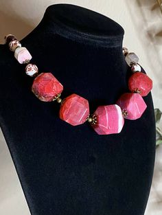 Necklace Length: 45.5+7cm (18+2.75in)*Weight: 133g Bracelet Length: 18.5+4cm (7.25+1.5in)* Weight: 26g Earrings Length: 33mm Weight: 6g Necklace “Wild Roses” - Porcelain Beads, Garnet, Pink Agate Raw Faceted Beads (biggest 26x26mm), Mother of Pearl, Brass Accessories.Pink Agate- a symbol of good luck. It is believed that the longer you wear pink agate, the better it works.Garnet- the stone with the most powerful energy. Helps to achieve goals and not lose enthusiasm. Needed by every traveler, bu Unique Faceted Jewelry For Gifts, Spiritual Agate Jewelry, Pink Bohemian Jewelry With Faceted Beads, Bohemian Pink Jewelry With Faceted Beads, Costume Jewelry With Round Beads And Stones, Spiritual Agate Jewelry For Weddings, Costume Jewelry Gift With Stones, Faceted Beads Round Jewelry, Adjustable Pink Stone Necklace