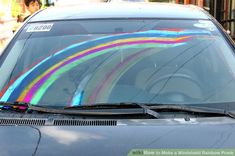 a car with rainbow painted on the windshield