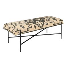 a black and white bench sitting on top of a metal frame with an animal print