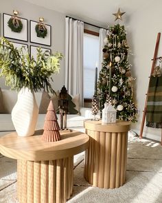 a living room filled with furniture and a christmas tree