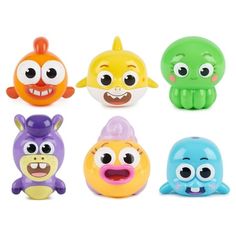 six different colored toys with eyes and mouths