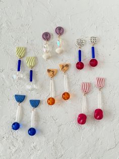 Turn heads with these vintage beaded earrings! Boasting a colorful array of vintage lucite beads and simple illustrated designs on ceramic stud pieces, these earrings will add a charming touch to any outfit! * White earthenware, glaze * Mix of vintage lucite beads * Securely affixed to titanium posts * Lengths range from approx. 1.5" to 3" long More beaded earrings: https://www.etsy.com/shop/quietclementine?section_id=17333677&ref=shopsection_leftnav_3 Please visit my shop policies before ordering for all shipping information: https://www.etsy.com/shop/quietclementine/policy?ref=shopinfo_policies_leftnav JEWELRY CARE Ceramic jewelry can be fragile and breakable, but will last a long time if proper care is taken. Here are a few tips for taking care of your special jewels. * Be careful when Ceramic Earrings, Lucite Jewelry, Ceramic Earring, Vintage Lucite, Ceramic Jewelry, Vintage Earrings, Clay Earrings, Jewelry Care, Handmade Ceramics