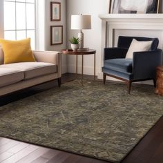 a living room with two couches and a rug on the floor in front of a fireplace