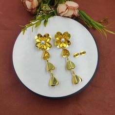 Freshwater Pearl Flower Earrings | 80mm 22k Gold Plated Handmade Earrings | Wedding Bridesmaid Floral Earrings | Dangle Earrings | Gift Idea. ZL279 Material: 22kt Gold Plated Brass Earrings Size: 80x25mm approx Pearl Size: 7mm approx Quantity: 1 Pair It's a perfect gift for mom, daughters, sisters, wife, bridesmaids, girlfriends, your best friend, and yourself. It's handmade with love for all occasions, such as bridal, wedding, anniversary, birthday, Mother's day, Valentine's Day, Christmas, and New Year's. A wonderful addition to any woman's jewelry collection. This product has been made by hand and may have slight irregularities that are a natural outcome of the human involvement in the process. ------------------------------- Click here to check more of our one of a kind earrings:- http Gold Dangle Flower Earrings For Wedding, Gold Plated Dangle Flower Earrings For Wedding, Gold Metal Flower Earrings For Wedding, Wedding Flower Dangle Earrings In Gold Plated, Gold Metal Danglers For Wedding, Metal Flower-shaped Earrings For Wedding, Metal Flower Shaped Earrings For Weddings, Flower-shaped Metal Earrings For Weddings, Gold Flower-shaped Earrings For Festive Occasions