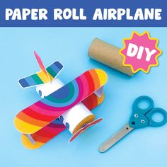 paper roll airplane next to scissors and glue on blue background with text that reads, paper roll airplane diy