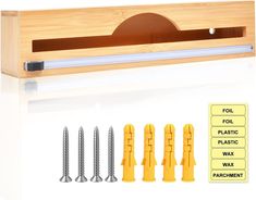 four screwdrivers are placed next to each other in front of a wooden box