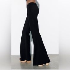 Zara Has Outdone Themselves With Their Numerous Designs Of Quintessential Black Dress Pants. This One Is A Sure Winner Because It’s Simple & Straightforward But Without Doubt A Fashion Statement. The Hidden Side Zip Closure Without Lumpy Pockets, And A Narrow High Waisted Band Ensures That It Sits Flat Against Your Waist And Flows Down Softly Into A Wide Leg, Giving You Shape And Style And Elongating Your Legs. Also It Gives You The Option To Match A Large Variety Of Boots/Stilettos/Chunky Platf Chic Wide-leg Fitted Jeans, Chic Fitted Wide-leg Jeans, Elegant Wide Leg Jeans For Business Casual, Non-stretch Full-length Jeans For Work, Chic Wide Leg Jeans For Business Casual, Trendy Full Length Bottoms For Business Casual, Chic Black Wide-leg Jeans, Stretch Full Length Jeans For Business Casual, Elegant Fitted Flare Bottoms