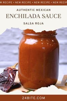 a jar of enchilada sauce sitting on top of a wooden table