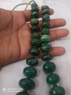 17 '' AAA 922 Caret Emerald Beryl Smooth Rondelle 13- 25MM Beads Gemstone Necklace with adjustable code Stone : Emerald Beryl Shape :- Rondelle Necklace - 17 inch 1 line string Size :- 13mm to 25mm Weight :- 922 carat Quality - AAA Polish :- Handmade color - green makes a great gift for your loved ones. It is known as the 'love stone' as the message it emits is the strong vibration of unconditional love, joy, warmth and healing. As quartz crystals are profound amplifiers of energy, it may help t Handmade Adjustable Emerald Necklace With Round Beads, Handmade Adjustable Beaded Emerald Necklace, Handmade Adjustable Emerald Necklace, Oval Emerald Bead Necklace For Jewelry Making, Emerald Necklace With Oval Gemstone Beads For Jewelry Making, Adjustable Jade Necklace With Large Beads, Rondelle Necklace, Pumpkin Bead, Carnelian Bracelet