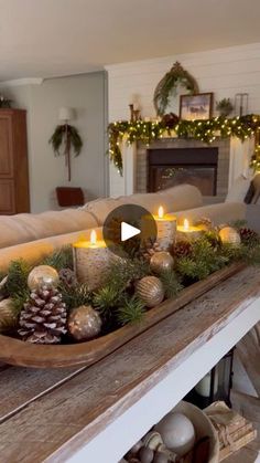 a living room filled with lots of furniture and christmas decorations on top of a wooden table