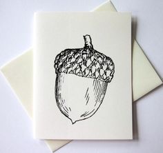 a card with a drawing of an acorn on it