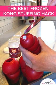 a person cutting up some food on top of a kitchen counter with the words, the best frozen kong stuffing hack