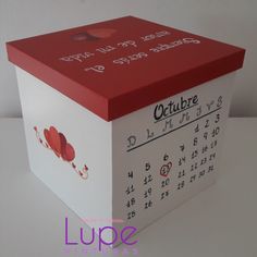 a red and white calendar box with hearts on it