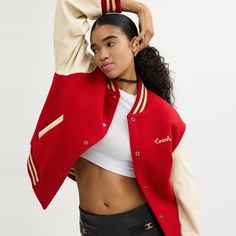 A symbol of team spirit and authentic American cool this vintage-inspired varsity jacket is an iconic Coach silhouette. Crafted in a mix of recycled wool and recycled polyester it's finished with smooth leather sleeves welt pockets signature striped ribbed trim and our embroidered cursive Coach script. | Coach Varsity Jacket - Women's Size XS - Red Varsity Jacket Women, Celebrity Magazines, Leather Sleeves, Long Sleeve Outerwear, Leather Sleeve, Red Jacket, Lightweight Jacket, Team Spirit, Outerwear Women