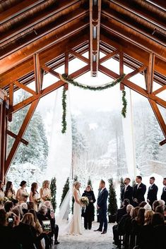 a bride and groom standing at the end of their wedding ceremony