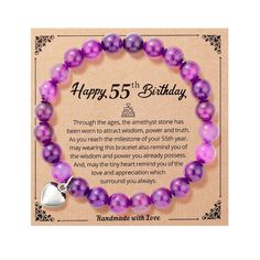 a purple bracelet with a silver heart charm on it's side and the words happy 5th