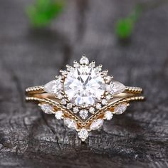 a close up of a ring on top of a piece of wood