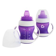 two purple and white baby bottles sitting next to each other