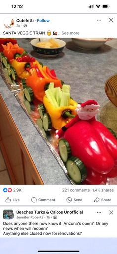 a long row of fake vegetables sitting on top of a counter