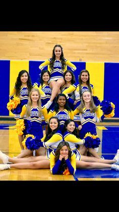 a group of cheerleaders posing for a photo