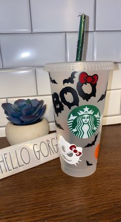 a starbucks cup with the name hello gorgo on it