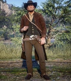 a man in a cowboy outfit standing next to a river