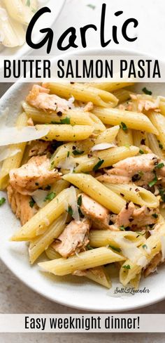 garlic and butter salmon pasta in a white bowl with text overlay that reads garlic butter salmon pasta