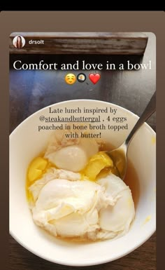 a bowl filled with food on top of a wooden table