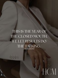 a woman in a white suit with her hand on her lap and the caption, this is the year of the closed mouth