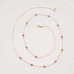 Gwen Timelessly beautiful, glistening Rubies appear to float on your neck, with refined elegance. You will immediately feel like royalty! The classic station necklace will be your go-to, and truly never goes out of style as it just enhances your natural beauty. Also, it’s such an easy style to layer with other dainty necklaces. July’s birthstone, this stunning necklace will be the perfect gift for a woman of any age! - Handmade- Solid Gold- Natural Ruby- Bezel Size: 3 mm- Space Between the Bezel Elegant Ruby Jewelry With Delicate Chain, Luxury 14k Gold Red Necklace, Luxury Red 14k Gold Necklace, Elegant Ruby Necklace With Delicate Chain, Fine Jewelry Red 14k Gold Necklace, Red 14k Gold Fine Jewelry Necklace, Red Ruby Necklace With Bezel Setting, Dainty Necklaces, Handmade Fine Jewelry