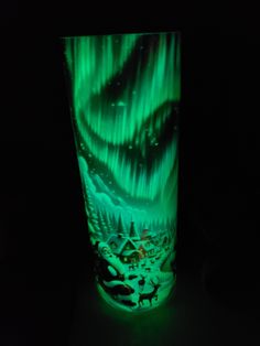 a glass with an image of the northern lights on it