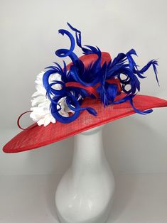 Red White and Blue Kentucky Derby Hat, Tea Party Hat & Church Hat! Make your statement with this stunning, high quality piece! *100% Brand new, hand made and high quality. *Head circumference: 22.5" and adjustable *Beautiful detail **Elegant fashion hats are perfect for horse racing events, church, the Kentucky derby, weddings, garden tea parties and charity events. ** Available to ship next business day. Don't forget matching gloves to complete the look! You can find them here! https://www.etsy.com/shop/QueenSugarBee?ref=seller-platform-mcnav&section_id=17799374 Ordering 4 or more pieces? Message me about group discounts! Like our Facebook page for future sales and new designs! Please join us here: https://www.facebook.com/QueenSugarBee Hear what others are saying about our shop: Jennifer Hat Tea Party, Kentucky Derby Fascinator, Church Hat, Tea Party Hats, Kentucky Derby Hat, Tea Party Garden, Charity Events, Derby Hat, Church Hats