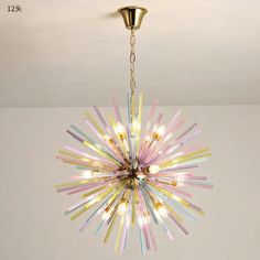 a chandelier hanging from the ceiling in a room with white walls and flooring