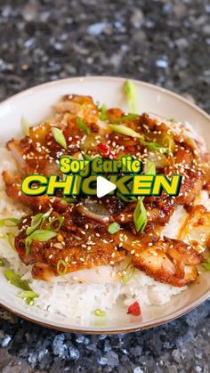 a white plate topped with chicken and rice on top of a granite counter next to a green sticker