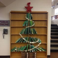 there is a christmas tree made out of books