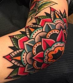 a colorful tattoo on the arm of a woman