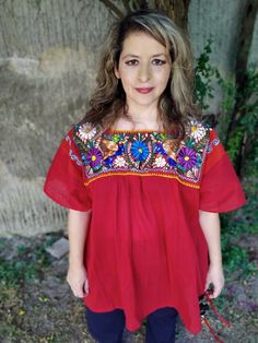 Beautiful and elegant RED BLOUSE radiant, fresh, comfortable, pretty, with beautiful flower embroidered Perfect for gift, and to use it at all times. FRIDA style Size 2XL CHEST 54 INCHES HIPS 60 INCHES LENGHT 31 INCHES In Mexico we make beautiful embroideries, with cheerful colors and very fresh fabrics. For ladies of all ages wash by hand, do not tumble, do not bleach Bohemian Blouse With Yoke And Short Sleeves, Traditional Red Peasant Top For Summer, Bohemian Red Blouse With Geometric Embroidery, Peasant Blouse With Red Floral Embroidery, Red Peasant Top With Floral Embroidery, Red Peasant Blouse With Floral Embroidery, Spring Red Embroidered Peasant Top, Traditional Embroidered Multicolor Peasant Top, Red Embroidered Cotton Peasant Top