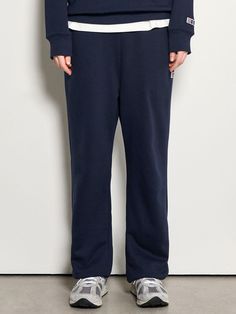 This is a comfortable and minimal sweat jogger pants that are made out of high quality polyester and cotton blend fabric. With design detail of loose silhouette and adjustable string inside the waistband, it gives a casual and comfortable look. - Loose silhouette- Cotton and polyester blend fabric with minimum distortion- Adjustable string inside the waistband- Elastic waistband and hem Navy Cotton Athleisure Joggers, Navy Cotton Sweatpants For Streetwear, Navy Cotton Joggers For Loungewear, Navy Sweatpants With Elastic Waistband For Loungewear, Navy Cotton Athleisure Pants, Navy Relaxed Fit Joggers For Streetwear, Navy Relaxed Fit Joggers For Loungewear, Navy Relaxed Fit Leisure Bottoms, Sweat Jogger