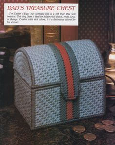 an advertisement for a knitted chest with red and blue stripes on the front, next to two pennets